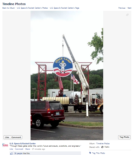 New Logo Sign Going Up on top of Red Gate at Space Camp